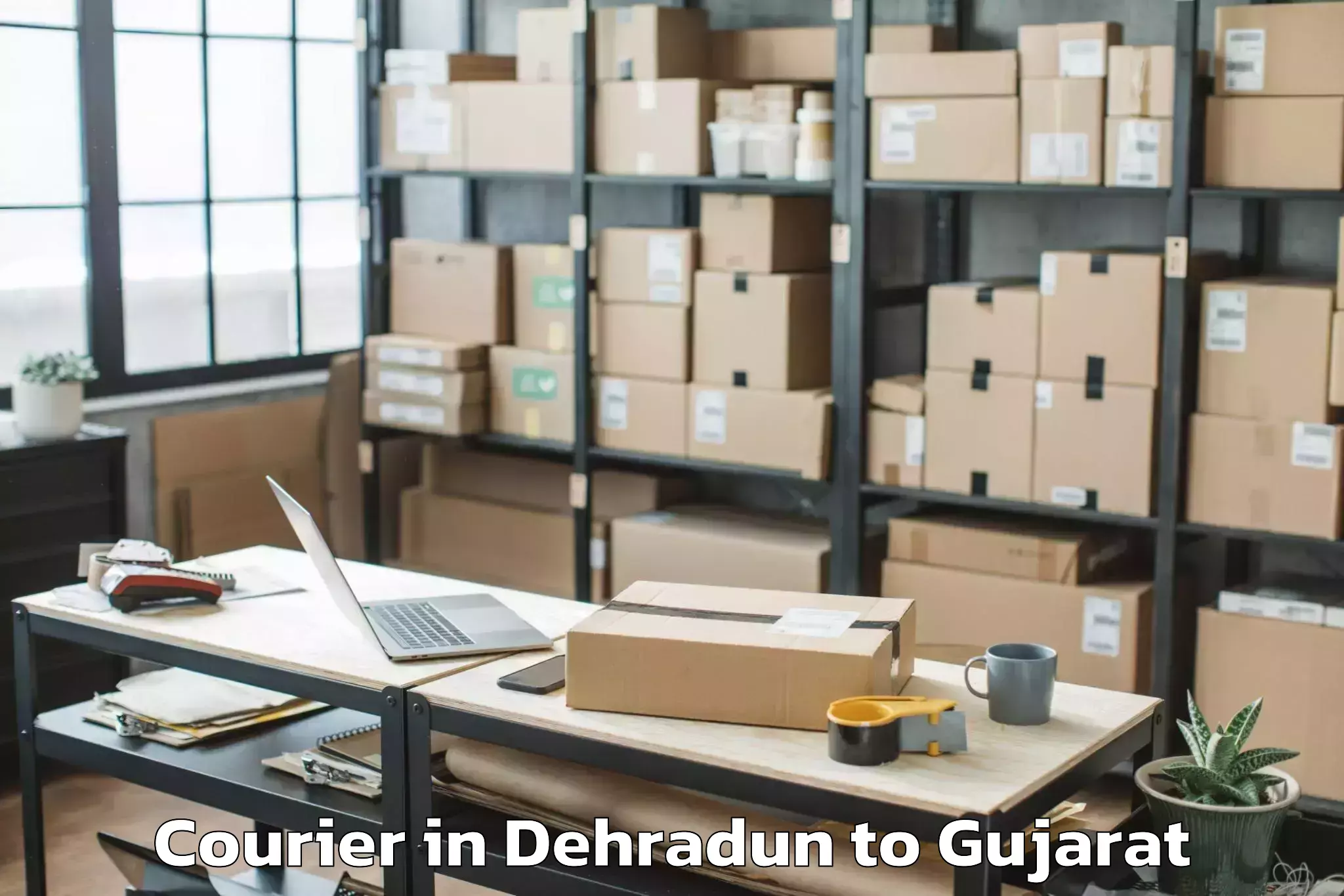 Get Dehradun to Gujarat University Of Transpla Courier